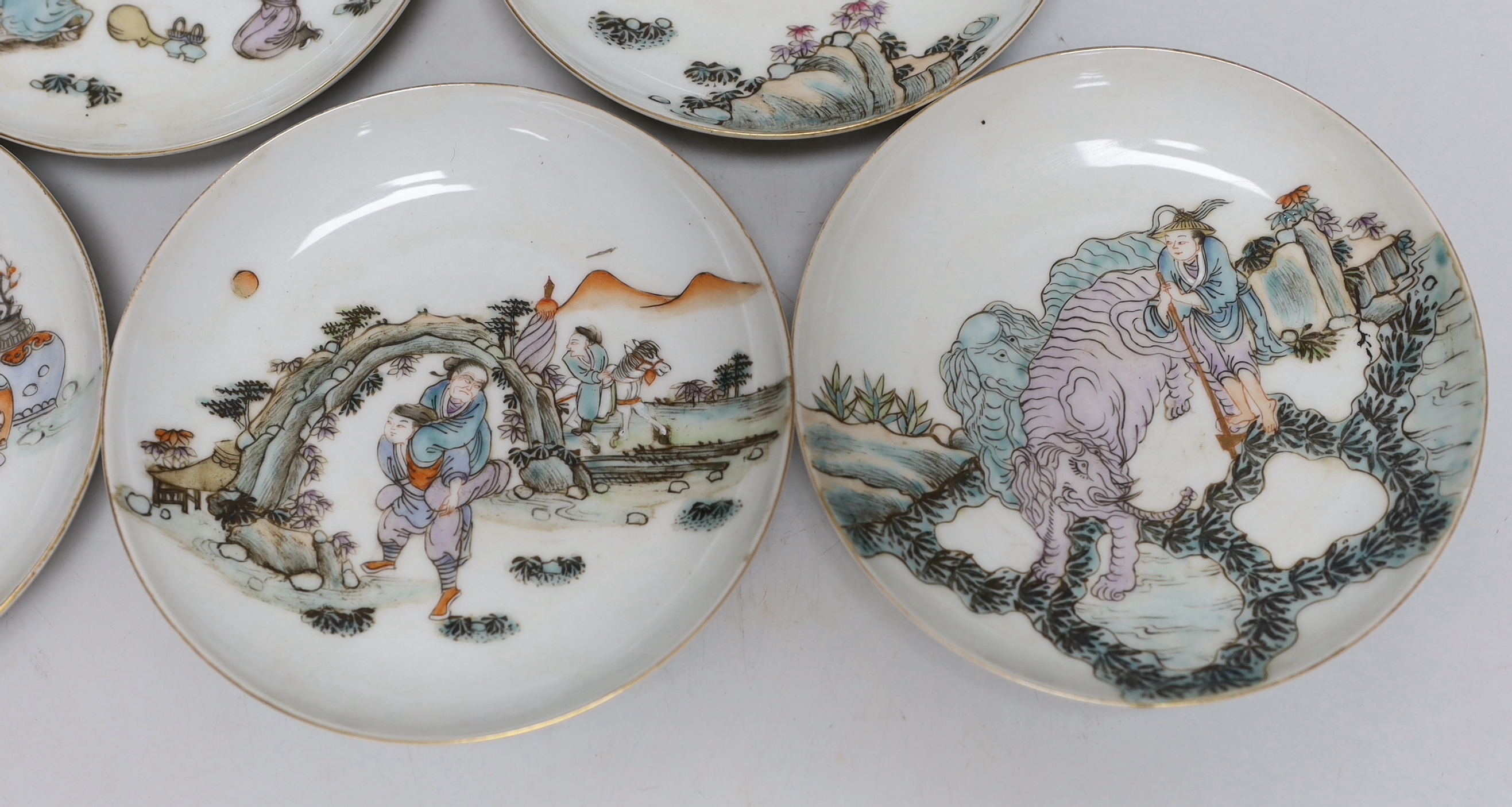 A set of five Chinese enamelled porcelain saucer dishes, decorated with figures and elders, each 13cm in diameter